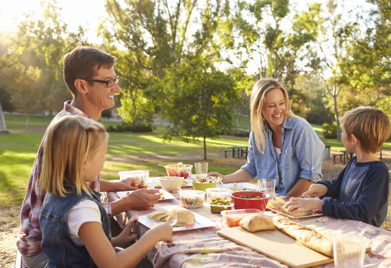 Family enjoying a picnic outdoors